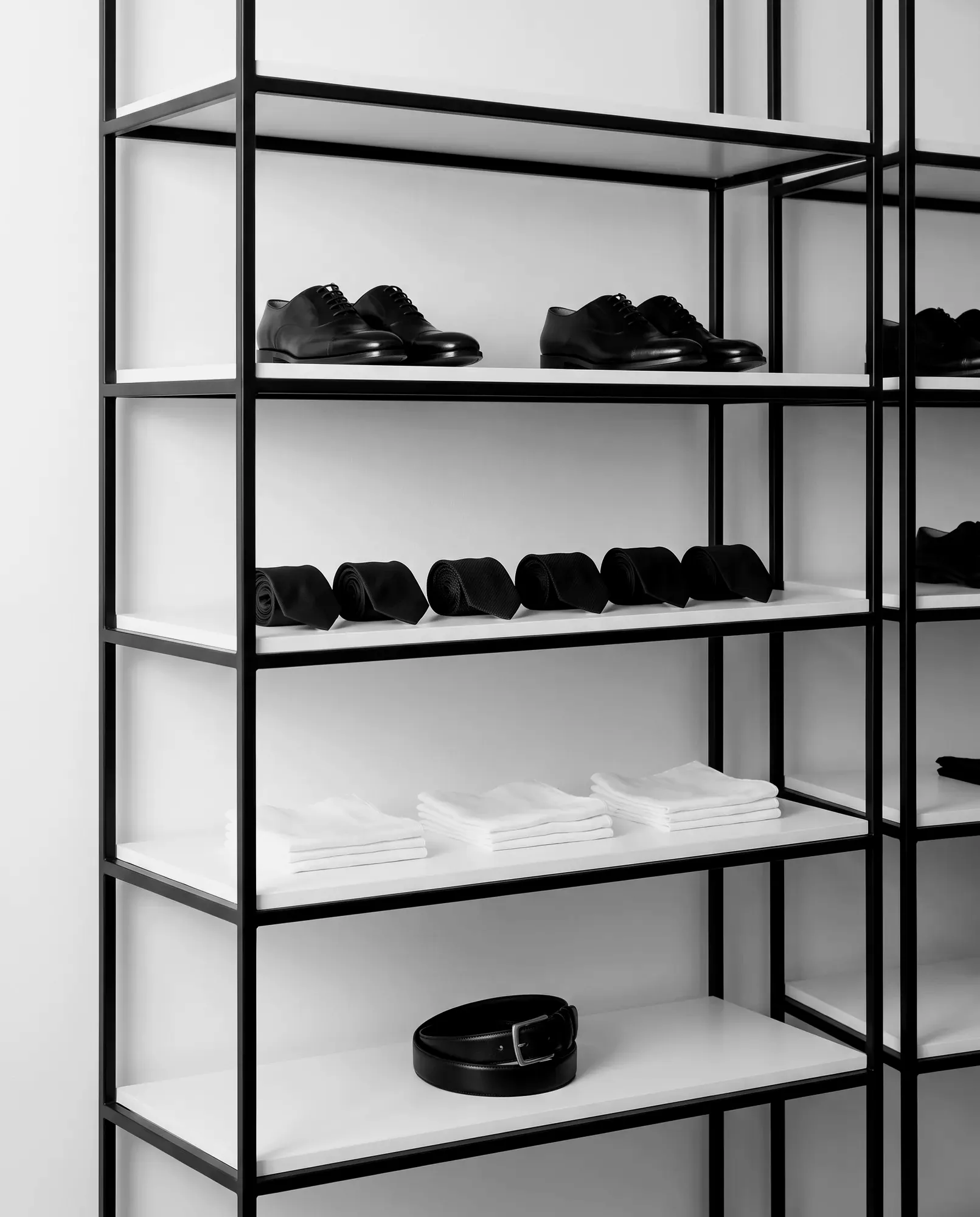 Accessories on black steel shelves